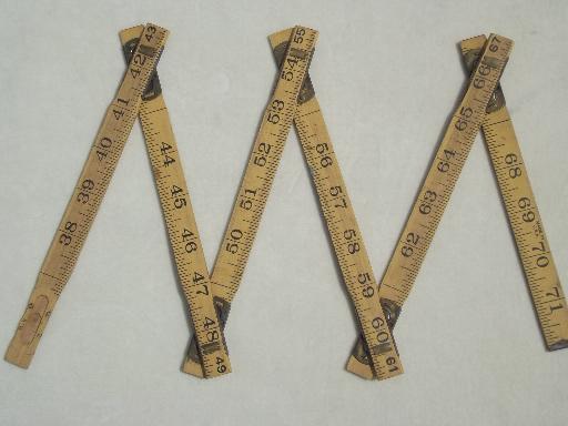 photo of antique wood measures, brass bound folding scales, old advertising tool rulers #5