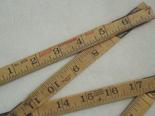 photo of antique wood measures, brass bound folding scales, old advertising tool rulers #6