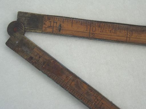 photo of antique wood measures, brass bound folding scales, old advertising tool rulers #10