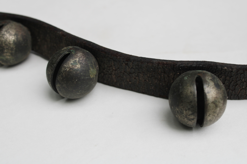 photo of authentic antique sleigh bells, silver tone brass bells on worn old leather strap horse harness #3