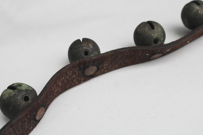 photo of authentic antique sleigh bells, silver tone brass bells on worn old leather strap horse harness #4