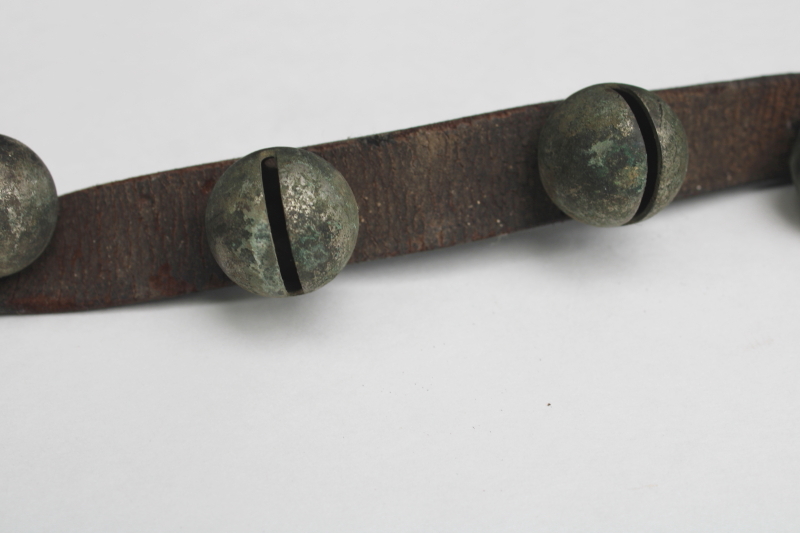 photo of authentic antique sleigh bells, silver tone brass bells on worn old leather strap horse harness #5