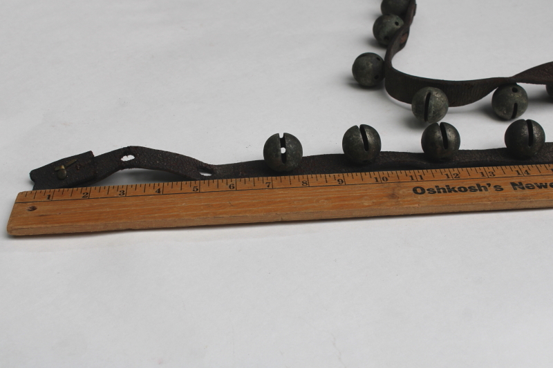 photo of authentic antique sleigh bells, silver tone brass bells on worn old leather strap horse harness #6