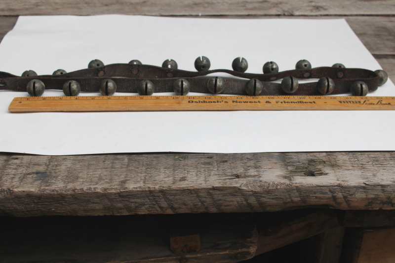 photo of authentic antique sleigh bells, silver tone brass bells on worn old leather strap horse harness #9