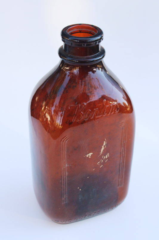 photo of authentic old Borden milk bottle, vintage amber brown glass w/ Gail Borden silhouette #4