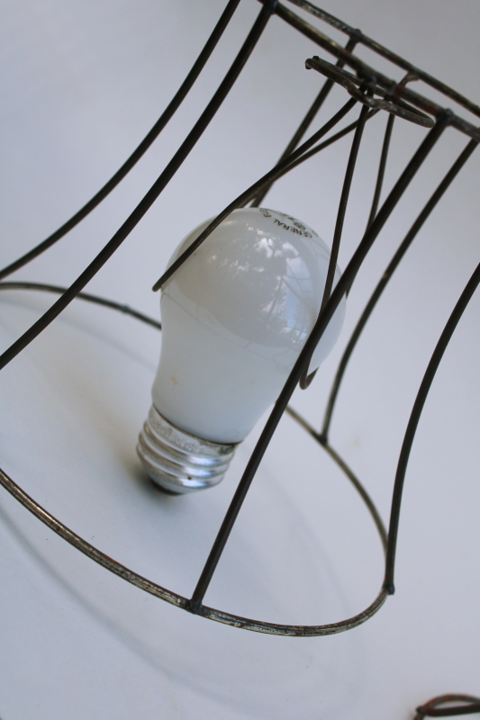 photo of bare wire lamp shade frames, trio of little bell shaped shades clip on bulb type chandelier light shades  #2