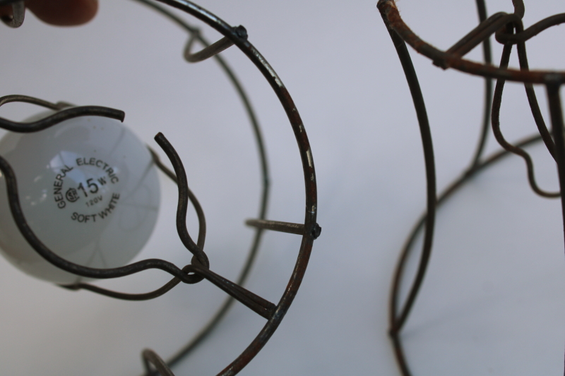 photo of bare wire lamp shade frames, trio of little bell shaped shades clip on bulb type chandelier light shades  #3