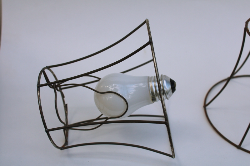 photo of bare wire lamp shade frames, trio of little bell shaped shades clip on bulb type chandelier light shades  #4