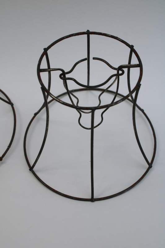 photo of bare wire lamp shade frames, trio of little bell shaped shades clip on bulb type chandelier light shades  #5