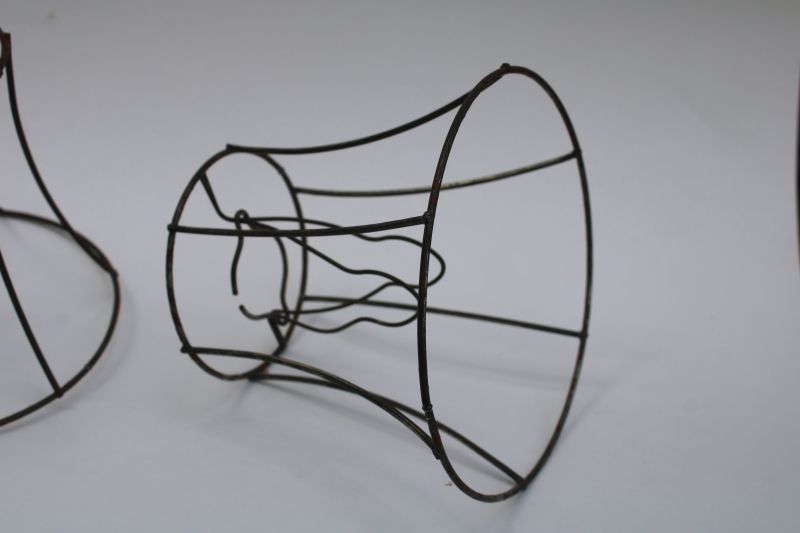 photo of bare wire lamp shade frames, trio of little bell shaped shades clip on bulb type chandelier light shades  #6