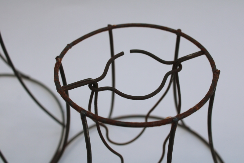 photo of bare wire lamp shade frames, trio of little bell shaped shades clip on bulb type chandelier light shades  #9