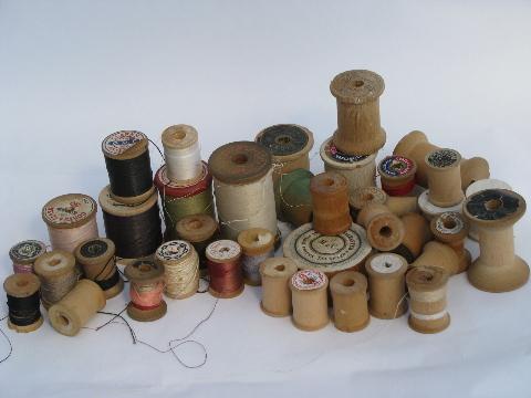 photo of big antique glass jars full of old silk, cotton thread, vintage wood spools #2