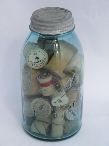 photo of big antique glass jars full of old silk, cotton thread, vintage wood spools #3