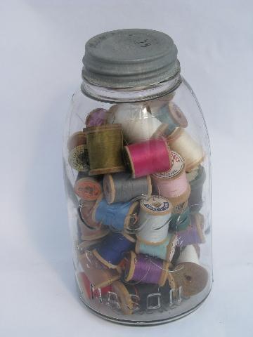 photo of big antique glass jars full of old silk, cotton thread, vintage wood spools #4