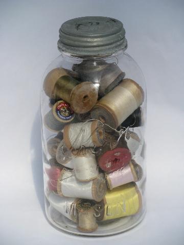 photo of big antique glass jars full of old silk, cotton thread, vintage wood spools #6
