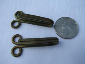 catalog photo of big heavy old brass coat or horse blanket hooks, vintage sewing notions