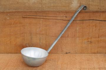 catalog photo of big old aluminum soup ladle or water dipper, rustic vintage primitive camp kitchen tool 