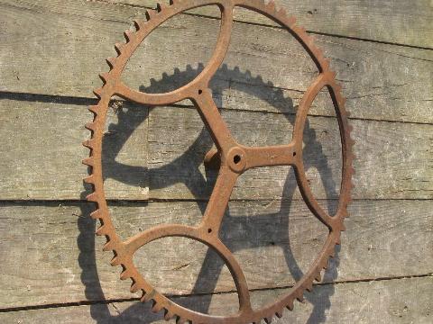 photo of big old antique forged iron toothed gear wheel, steampunk machine age #3