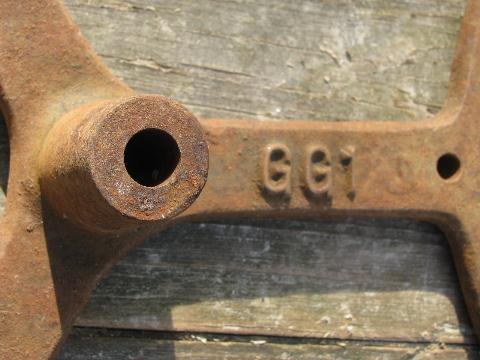 photo of big old antique forged iron toothed gear wheel, steampunk machine age #5