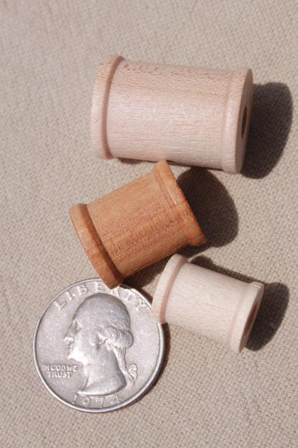 photo of big old herring barrel glass jar full of tiny wooden spools, wood spool lot #3