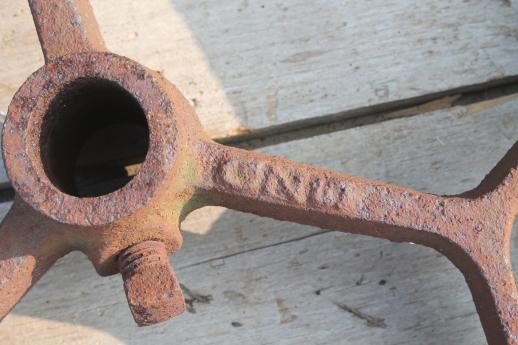 photo of big old iron fly wheel from steampunk vintage industrial machinery or farm equipment #6