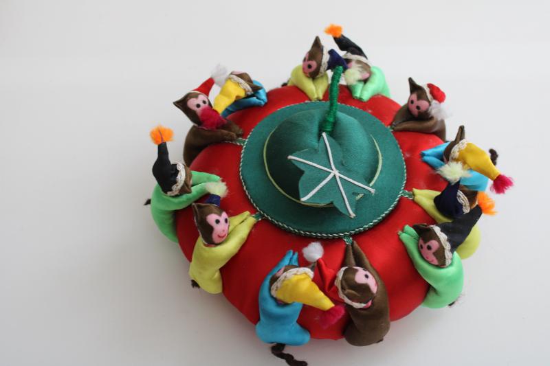 photo of big old round Chinese satin pincushion w/ ring of worry dolls tiny monkeys in hats #2