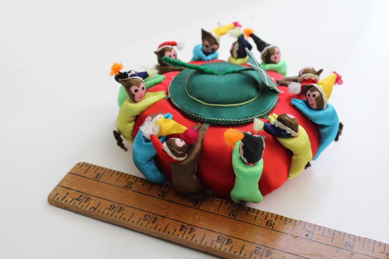 photo of big old round Chinese satin pincushion w/ ring of worry dolls tiny monkeys in hats #7