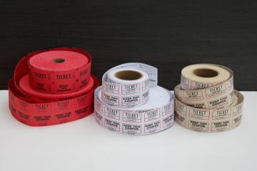 catalog photo of big rolls of paper tickets, red & white event or raffle tickets lot for upcycle etc