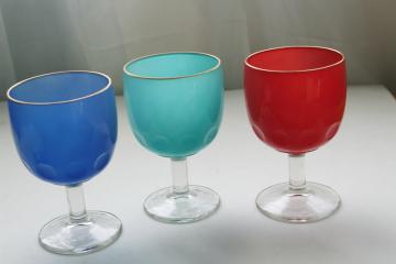 catalog photo of big vintage wine glasses or water goblets, retro colors red aqua blue