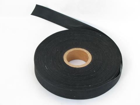 photo of black grosgrain / stiffened cotton hat band facing milliner's ribbon, large roll #1