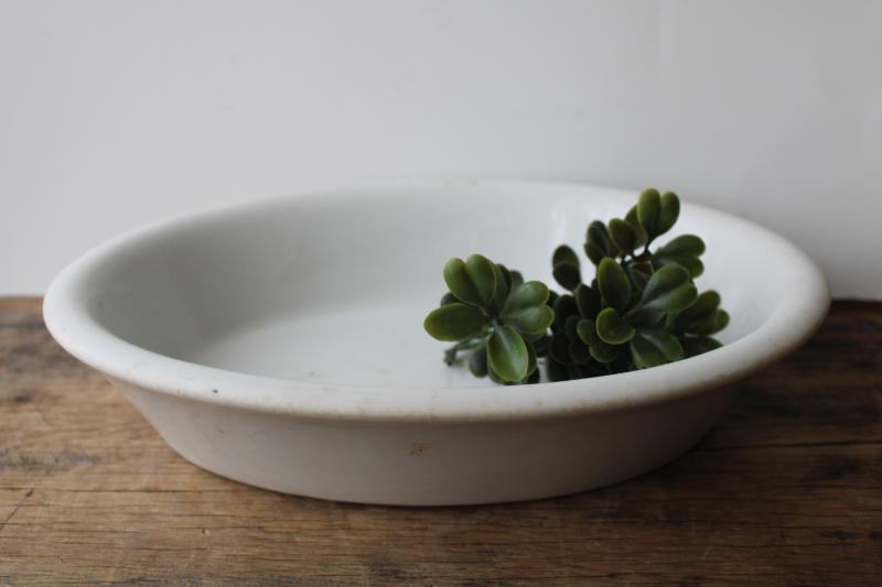 photo of browned old white ironstone china bowl, large oval basin turn of the century vintage #1