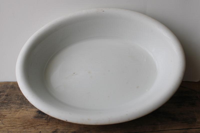 photo of browned old white ironstone china bowl, large oval basin turn of the century vintage #2