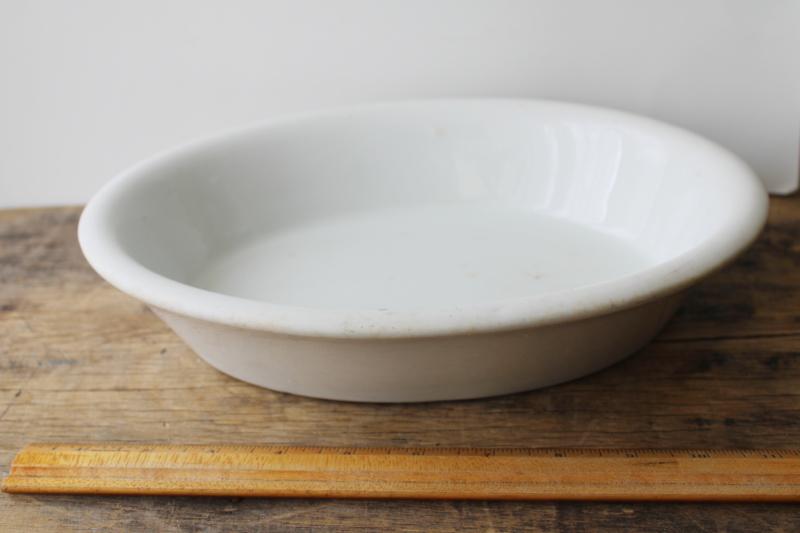 photo of browned old white ironstone china bowl, large oval basin turn of the century vintage #6