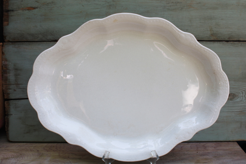 photo of browned old white ironstone china platter, scalloped edge tray w/ embossed border #1