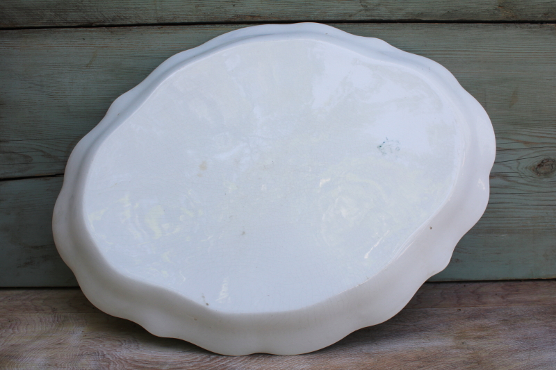 photo of browned old white ironstone china platter, scalloped edge tray w/ embossed border #6