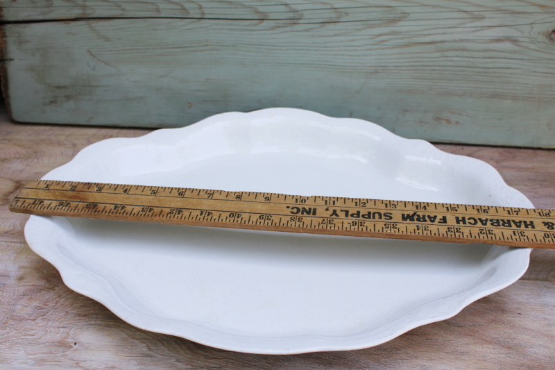 photo of browned old white ironstone china platter, scalloped edge tray w/ embossed border #9