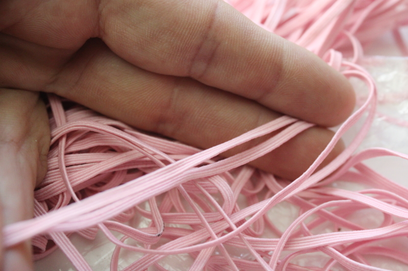 photo of bulk lot baby elastic 1/8 inch wide soft stretchy braid in many colors, shades of pink, blues, purple  #3