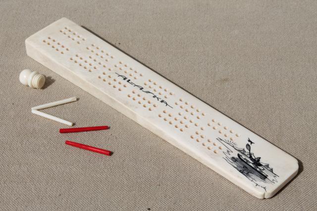 photo of carved bone cribbage board, signed scrimshaw style art souvenir of Alaska #1