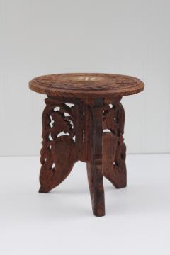 catalog photo of carved wood mini table plant stand made in India, trivet top w/ folding base, vintage boho decor