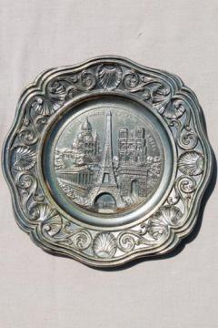 catalog photo of cast metal souvenir w/ scene of Paris, French collector's plate w/ antique bronze finish