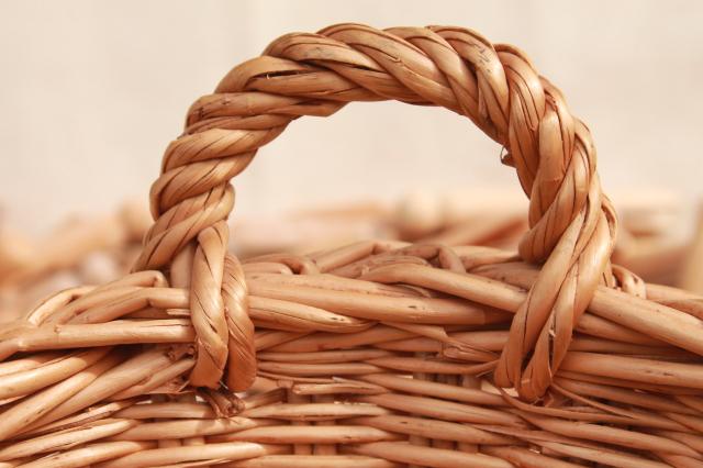 photo of child's size vintage wicker laundry basket full of old wood clothespins #2