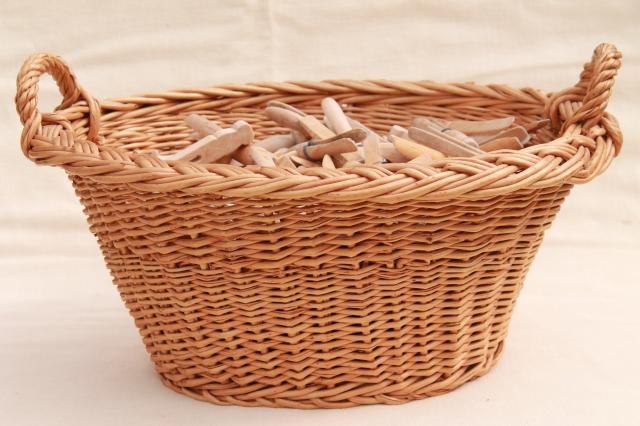 photo of child's size vintage wicker laundry basket full of old wood clothespins #3