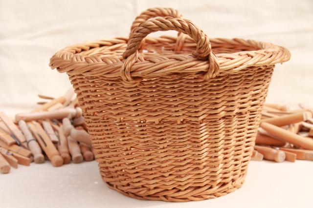 photo of child's size vintage wicker laundry basket full of old wood clothespins #7