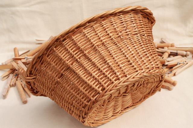 photo of child's size vintage wicker laundry basket full of old wood clothespins #8