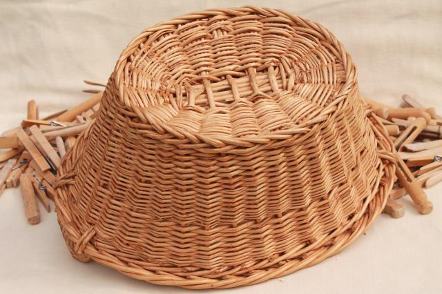 photo of child's size vintage wicker laundry basket full of old wood clothespins #10