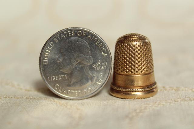 photo of collection of antique sewing tools - thimbles including sterling silver, vintage needle case #5