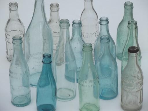 photo of collection of old soda & water bottles, heavy clear glass & aqua blue glass bottles #1