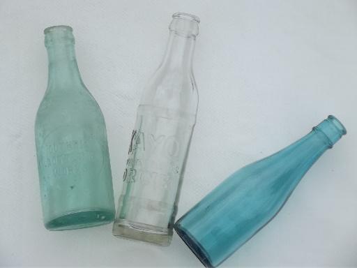 photo of collection of old soda & water bottles, heavy clear glass & aqua blue glass bottles #2