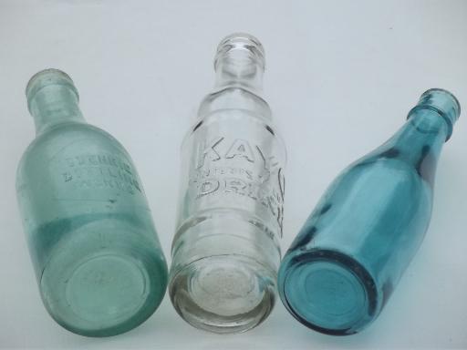 photo of collection of old soda & water bottles, heavy clear glass & aqua blue glass bottles #3