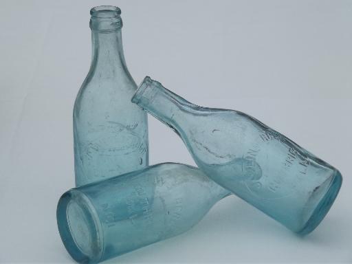 photo of collection of old soda & water bottles, heavy clear glass & aqua blue glass bottles #9